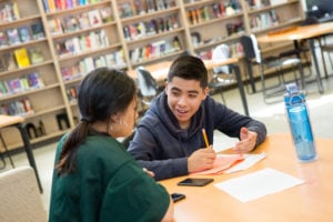 Students at Skyline High School work together during an after-school tutoring club.